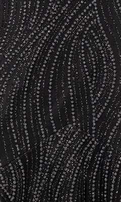 Close-up of black fabric from the Long Black Glitter Prom Gown: Blondie Nites 5491BN, featuring swirling patterns of small, shiny beads and glittery accents.
