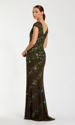 A woman models the Mac Duggal 5500 beaded long formal dress, featuring cap sleeves, a floor-length silhouette, sequins in a floral pattern, and a deep V-back, set against a plain white background.