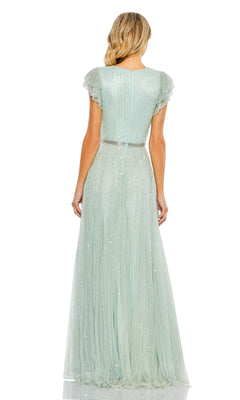 A woman faces away, wearing the Mac Duggal 5502 Sequin-Stripe Long Formal Dress—a floor-length, short-sleeved gown in light green with sparkling stripes, pleats, and a fitted waist.