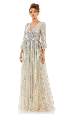 A woman wears the Mac Duggal 5509 long sleeve formal dress, featuring sequins, a V-neckline, three-quarter sleeves, and a pleated skirt, standing against a plain white background.
