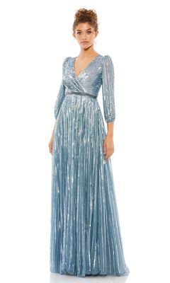 Woman wearing the Mac Duggal 5509 Long Sleeve Long Formal Dress in light blue with a shimmery finish, V-neckline, and pleated skirt, standing against a plain white background.