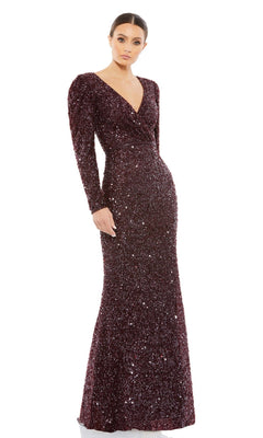 A woman wears the Mac Duggal 5510 Long Sleeve Sequin Formal Dress in dark burgundy with a V-neckline, standing against a white background.