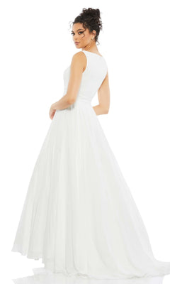 A woman in the Long Formal Dress 55272 by Mac Duggal, a sleeveless, floor-length white tulle ball gown, stands turned slightly away and looks over her shoulder against a plain white background.