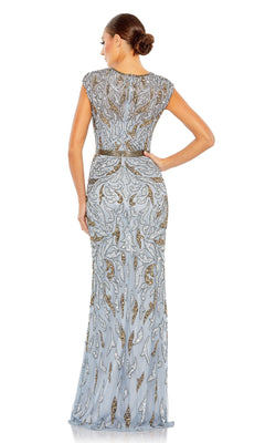 A woman faces away, wearing the Silver Long Sequin Formal Dress (Mac Duggal 5532), a gorgeous formal gown adorned with shimmering silver sequins. Her low bun hairstyle makes her look ideal for a mother of the bride.