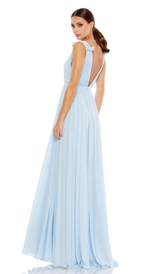 A woman poses against a white background, looking over her shoulder in the Classic Long Formal Dress: Mac Duggal 55321, a light blue evening gown featuring a deep V back.