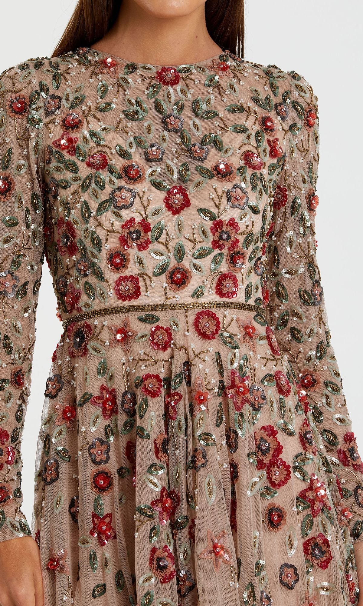 A close-up of the Beaded Long Sleeve Formal Dress: Mac Duggal 5533, showcasing sheer fabric with detailed red, green, and silver floral embroidery and beadwork.