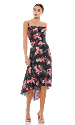 Woman wearing the Black Floral-Print High-Low Party Dress 55392 with red flowers and white polka dots, paired with nude heels and standing against a white background—a stunning choice for any party occasion.