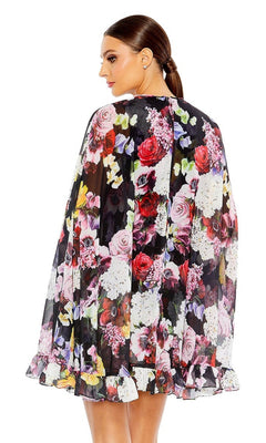 A woman with a sleek ponytail faces away, highlighting the sheer ruffled cape and floral print of the Mac Duggal 55404 Short Print Cape Hoco Dress.