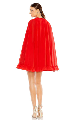 A woman stands with her back to the camera, wearing the Long Sleeve Short Red Dress 554071 by Mac Duggal and beige high-heeled shoes.