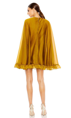 A woman faces away from the camera wearing the Mac Duggal 55407 Cape-Sleeve Short Ruffled Party Dress in golden yellow, featuring sheer cape sleeves and a ruffled hem—ideal for semi-formal cocktail events.