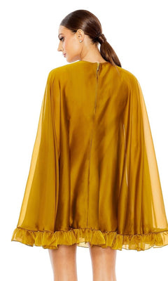 A woman with straight brown hair in a low ponytail is seen from the back wearing the gold Mac Duggal 55407 Cape-Sleeve Short Ruffled Party Dress, which features long sleeves and a short ruffled cape.