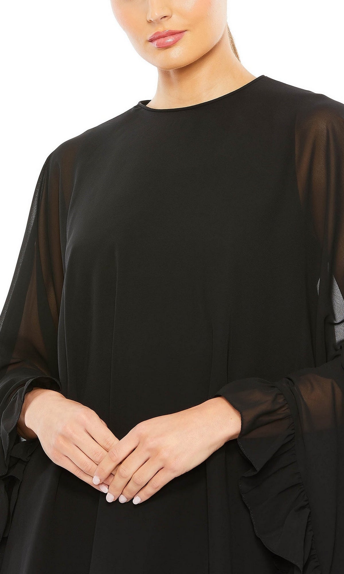 Woman wearing the Mac Duggal 55407 Cape-Sleeve Short Ruffled Party Dress, featuring ruffled cape sleeves, standing with hands gently clasped.