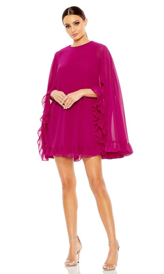 A woman stands against a white background wearing the Mac Duggal 55407 Cape-Sleeve Short Ruffled Party Dress in bright magenta with sheer sleeves and clear-strap heels.