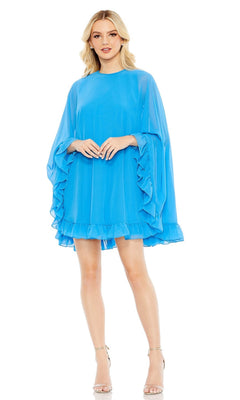 A woman wears the Mac Duggal 55407 Cape-Sleeve Short Ruffled Party Dress, a loose-fitting, knee-length bright blue cocktail dress with ruffled sleeves and hem, paired with strappy high-heeled sandals.