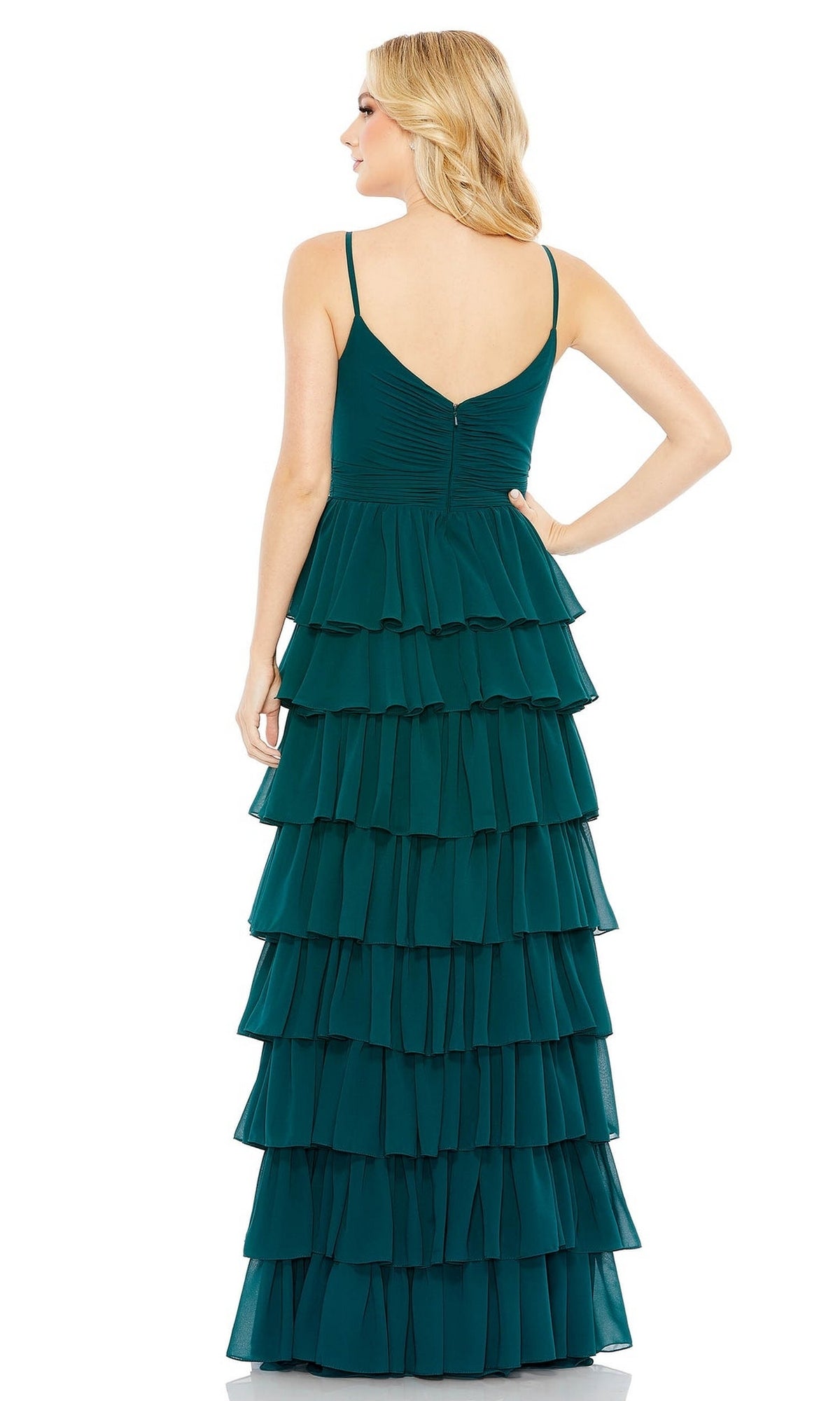 A woman faces away, wearing the Mac Duggal 55416 Ruffled Long A-Line Prom Dress—a sleeveless dark teal gown with thin straps and layered ruffles cascading down the skirt.