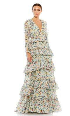 A woman wears the Long Formal Dress 55664 by Mac Duggal, a v-neck, long-sleeve gown with multiple ruffled tiers, vibrant floral print on a light background, and an elegant floor-length silhouette.