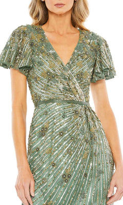Woman wearing the Midi Sage Green Semi-Formal Dress: Mac Duggal 5582, a beaded cocktail dress featuring gold and silver sequin swirls, V-neck, and fitted waist.