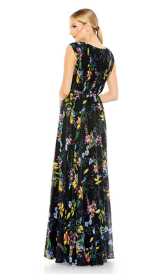 A woman faces away, wearing the Mac Duggal 55829 Long Floral-Print Formal Dress—black, sleeveless, and adorned with colorful florals.