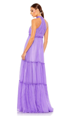 A woman stands facing away, looking over her shoulder, modeling the Mac Duggal 55848 High-Neck Long Formal Dress against a plain white background.
