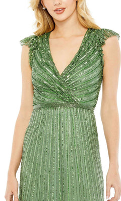A woman wearing the Mac Duggal 5585 Cap-Sleeve Midi Party Dress, featuring a V-neck, green beaded semi-formal design with pleated details and embellished shoulders.