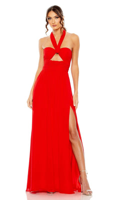 A woman in the Long Formal Dress 55898 by Mac Duggal, a sleeveless floor-length red gown with cut-out sides, a halter neckline, front cutout, and thigh-high slit, paired with strappy high-heeled sandals.
