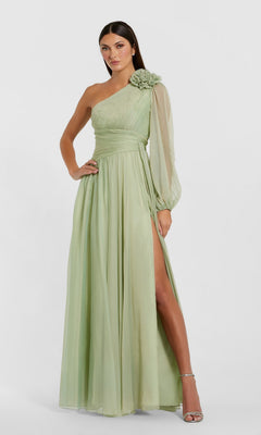 A woman wearing the Mac Duggal 56142 long formal dress in sage—a light green, one-shoulder evening gown with a floral accent and long sheer sleeve, featuring a high slit and a floor-length skirt—creates an elegant look perfect for any formal occasion.