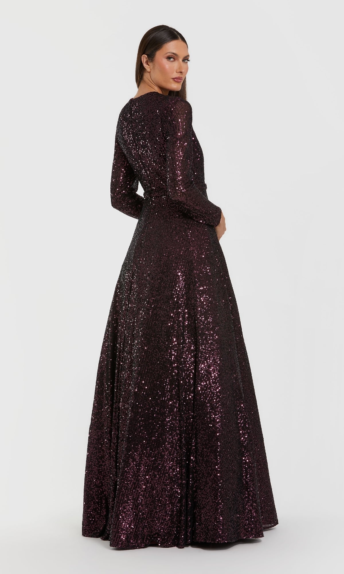 A woman stands with her back to the camera in the Amethyst Sequin Formal Dress: Mac Duggal 56178, shown against a plain white background.