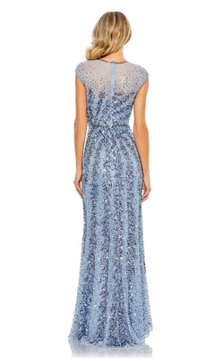 A woman with long, wavy blonde hair is seen from behind wearing the Mac Duggal 5619 sleeveless beaded long formal dress in light blue, featuring a sheer upper back.