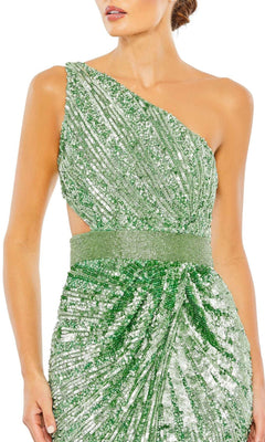 A woman wearing the Mac Duggal 5687: a green one-shoulder sequin formal dress featuring a waist cut-out and a gathered, draped skirt.