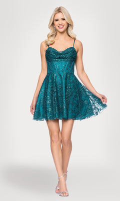 A woman in a teal Blondie Nites 5713BN cowl-neck short hoco dress with spaghetti straps and lace details, paired with silver high heels, stands against a plain background.