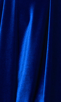 Close-up of royal blue velvet fabric with soft folds and a smooth, slightly shiny texture—ideal for the affordable Short Velvet Hoco Dress: Blondie Nites 5718BN, perfect as a chic cocktail or strapless homecoming dress.