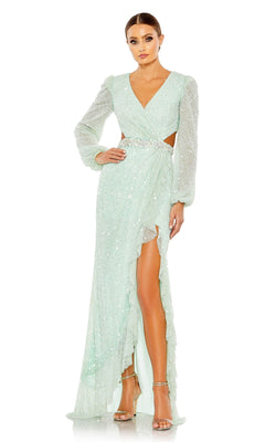 A woman stands against a white background wearing the Mint Long Sleeve Long Sequin Formal Dress 5745, featuring a deep V-neck, cutout waist, high slit, and silver high-heeled sandals.