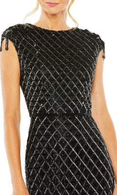 A woman wearing the Mac Duggal 5776 Beaded Black Midi Formal Dress, featuring a textured geometric diamond pattern and subtle shoulder tassel details.