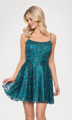 A woman in the Mini Teal Glitter Hoco Dress (Blondie Nites 5802BN) with thin straps and sequin details holds out the skirt and looks down with a slight smile.