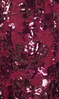Close-up of the Blondie Nites 5883BN long prom dress fabric, featuring floral lace adorned with shiny magenta and dark pink sequins.