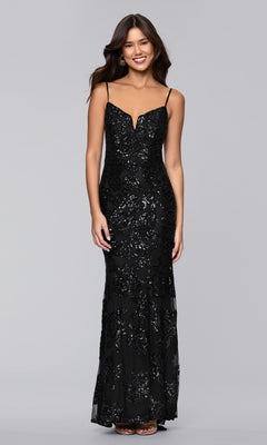 A woman wears the Blondie Nites 5905BN long prom dress, a form-fitting, floor-length black sequin gown with floral patterns, standing against a plain gray background.