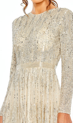 A woman models the Mac Duggal 5923, a cream-colored long sleeve sequin cocktail dress with silver sequins and beading—an elegant semi-formal party choice.