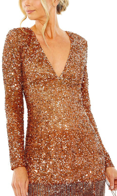 A woman wears the Mac Duggal 5928 Short Beaded Copper Hoco Dress, featuring long sleeves, a V-neckline, copper sequins, and fringe at the hem.