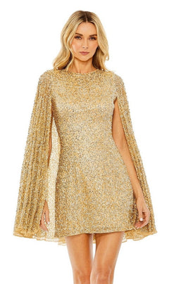 A woman models the Mac Duggal 5931 Short Gold Beaded Cocktail Dress with cape sleeves, standing against a plain white background.
