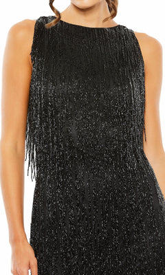 A woman wears the Mac Duggal 5934 Short Beaded Fringe Party Dress, featuring black fabric with vertical silver beaded fringe accents.