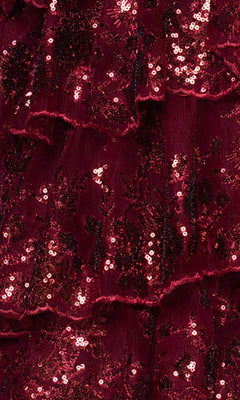 Close-up of the Blondie Nites 5962BN long prom dress, showcasing its burgundy tiered ruffle skirt adorned with shiny floral sequin embellishments.