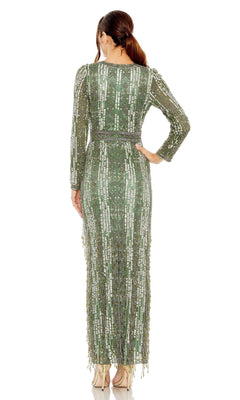 A woman stands with her back to the camera, wearing the Long Formal Dress 5981 by Mac Duggal in green, featuring long sleeves, intricate beading and sequin details, paired with beige high heels.