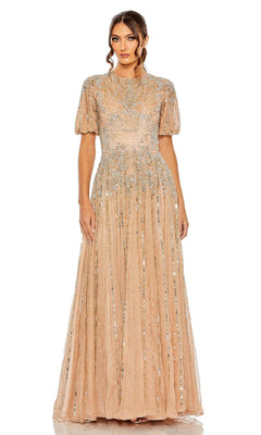 A woman wears the Mac Duggal 5991 Short Sleeve Beaded Formal Dress, a floor-length evening gown adorned with silver sequin embellishments, and looks directly at the camera.