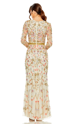A woman with brown hair in a ponytail is seen from the back wearing the Long Formal Dress 6016 by Mac Duggal, featuring floral beading, sheer long sleeves, and a nude formal design.