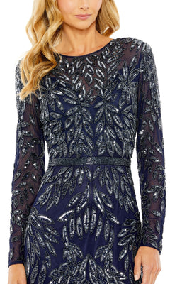 A woman in the Mac Duggal 6023 long blue beaded formal dress featuring sheer long sleeves and silver leaf-shaped sequin embellishments.