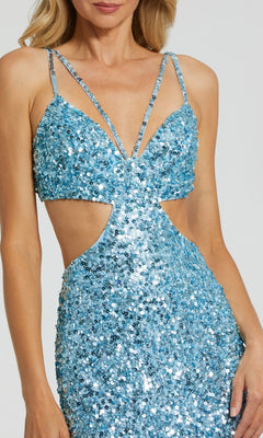 A woman wears the Long Formal Dress 6077 by Mac Duggal, featuring light blue sequins, thin straps, a waist cut-out, open back, and a deep neckline.