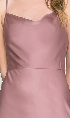 A person wearing a sleeveless, blush pink Cowl-Neck Simple Tea-Length Satin Dress 6115 with thin straps.