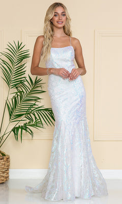 A woman stands indoors by a green potted plant against a beige wall, wearing the Iridescent Long Embellished Prom Dress 6116—a sleeveless, fitted white gown with shimmering details.