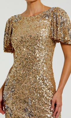 A woman wearing the Mac Duggal 6118 Sequin Wedding-Guest Midi Dress, featuring gold sequins, short puff sleeves, and intricate silver detailing, shown from the shoulders to mid-thigh.