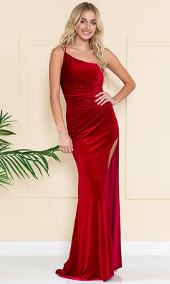 A woman in the One-Shoulder Long Velvet Formal Dress 6118, a fitted floor-length gown with a thigh-high slit, stands indoors smiling with one hand on her hip.
